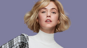 A blonde woman with medium-length hair facing the camera